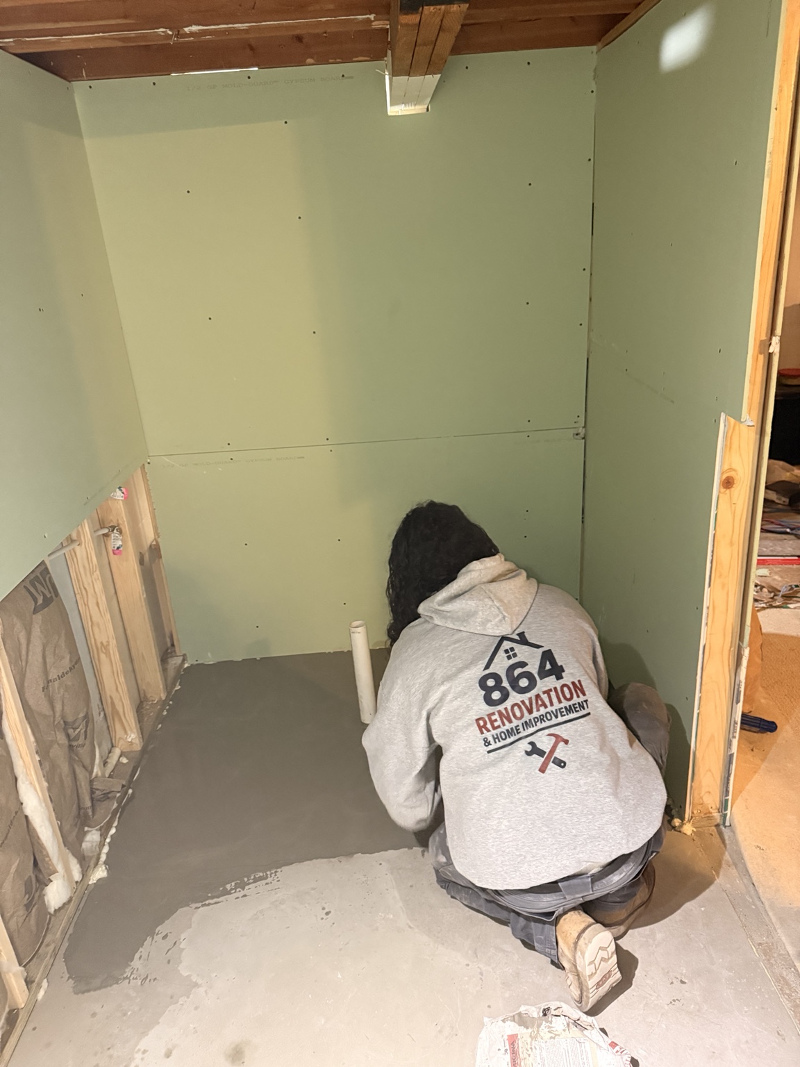 Crew member working on a home interior